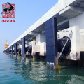 Durable marine cone fender system with facing pad and uhmwpe panel